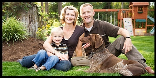 Family with dog in yard